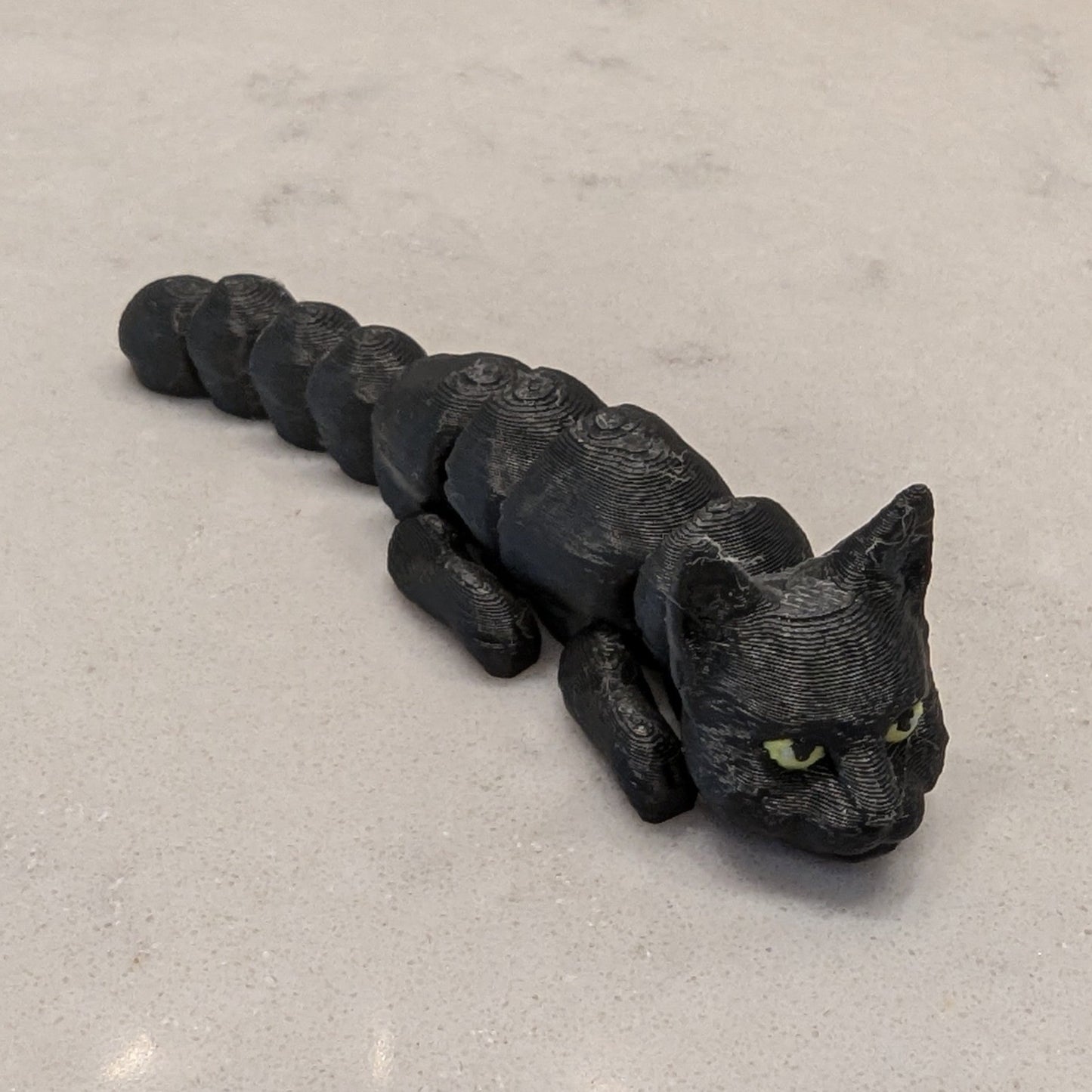 3d Printed Flexi Cats - White, Black and White, Yellow, Black, Siamese, Gray, Black with Purple Hat